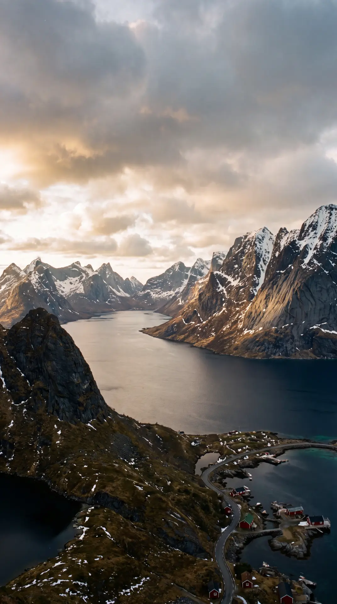Aerial view of a dramatic fjord landscape at dusk